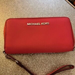 Multiple wristlets and one wallet with the celll phone holder